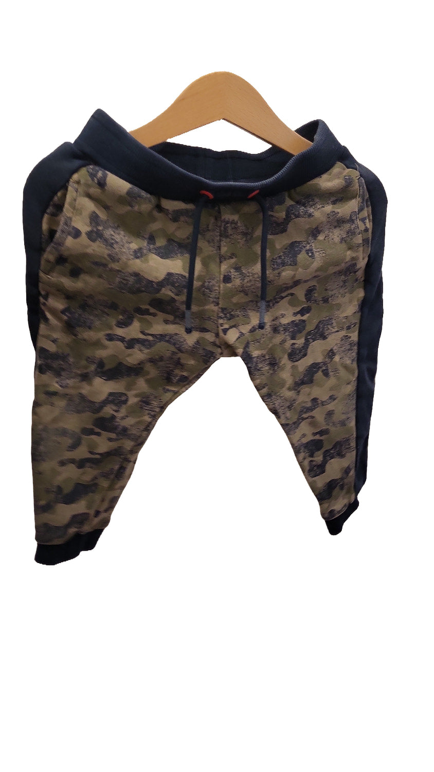 Front of the camouflage joggers showing the drawstring waist, navy side panels and navy elasticated cuffs at the ankles.